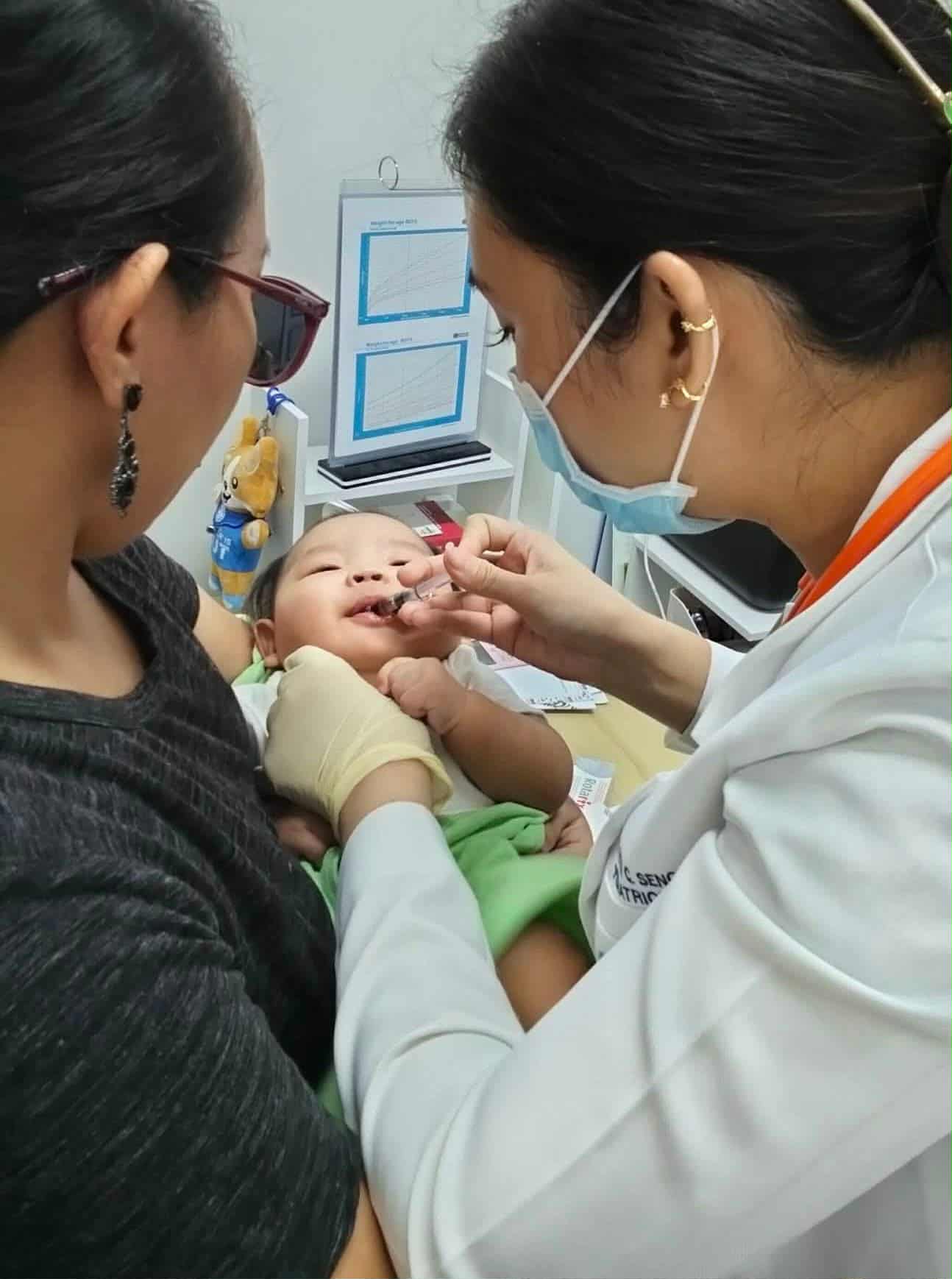 Doctor with baby at Health Plus